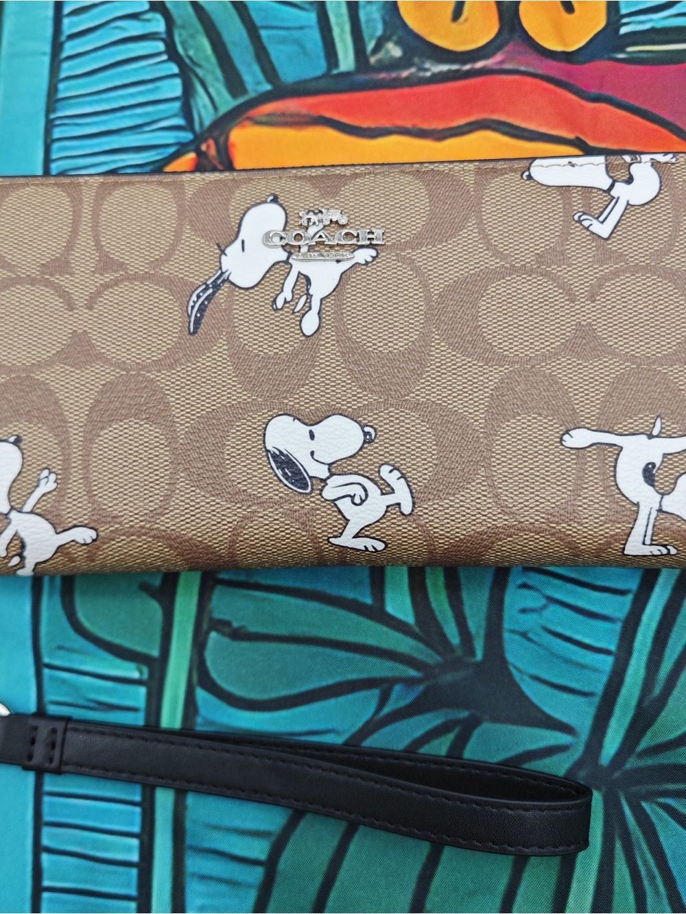 COACH Brown Signature x Snoopy Wristlet with Black Strap